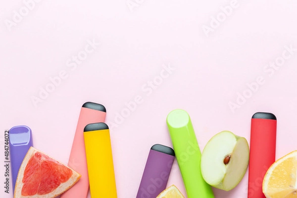 Fototapeta Electronic cigarettes with different fruit flavors with ingredients on colored backgrounds