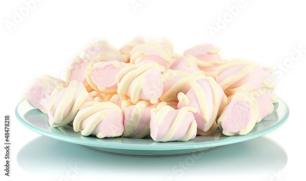 Fototapeta Marshmallows on color plate isolated on white