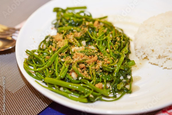 Obraz Stir-fried vegetables and rice on a plate 
