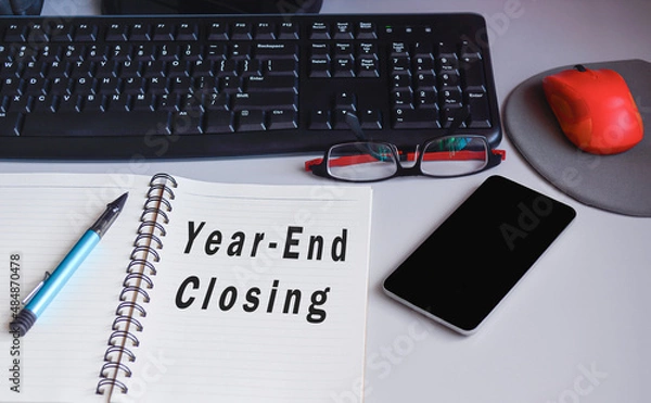Fototapeta Text on notepad on a desk - Year end closing. Audit and accounting concept