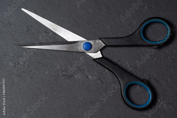 Obraz  old scissors on a black background