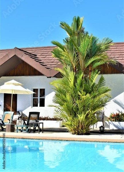 Fototapeta A poolside cabana in a relaxing resort