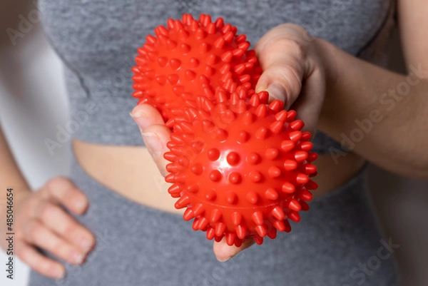 Obraz Double red back massage ball with spikes in hand.