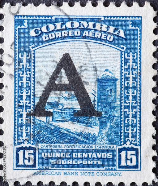 Fototapeta Colombia - circa 1948 : a postage stamp from Colombia, showing a Spanish Fortification, Cartagena. overprint A