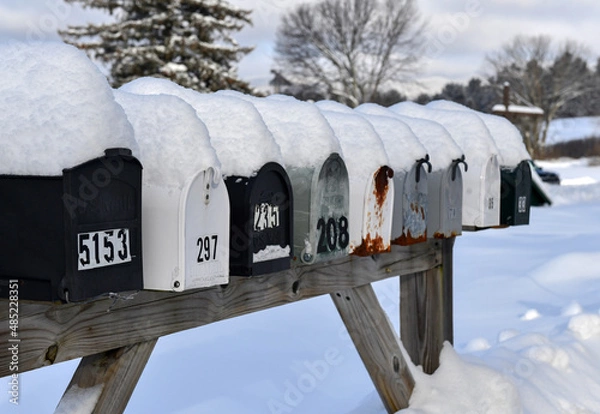 Obraz Mailboxes covered with fresh snow along rural road