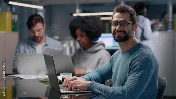 Obraz Successful entrepreneur smiling at camera working in modern startup company. 