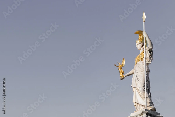 Obraz The statue of Pallas Athena on gray background with copy space for your design near Parliament building in Vienna, Austria