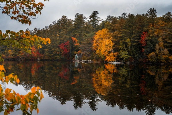 Fototapeta Boathouse on lake in the fall