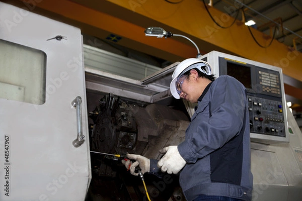 Obraz mechanical technician of cnc machine