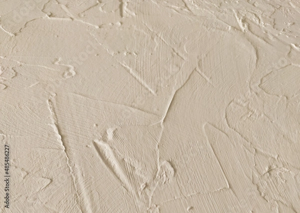 Fototapeta beige textured decorative stucco background with place for text