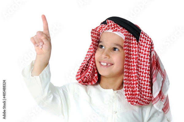 Fototapeta Cute Arabic little boy pushing digital button