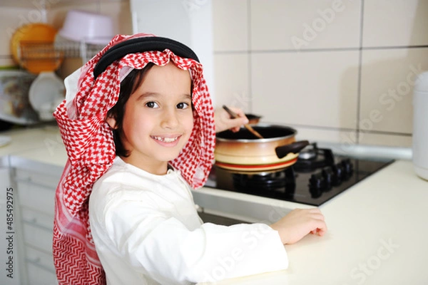 Fototapeta Little kid boy is cooking , high quality photos