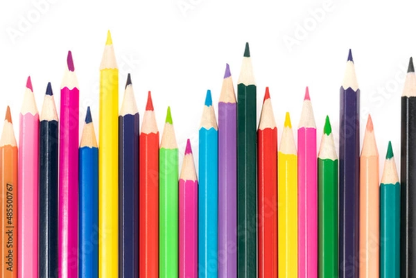 Fototapeta Wooden colored pencils isolated on a white background. A line of multicolored pencils in a large plan
