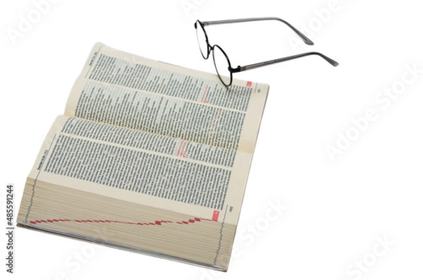 Obraz Glasses lying on the Bible in Polish isolated on a white background
