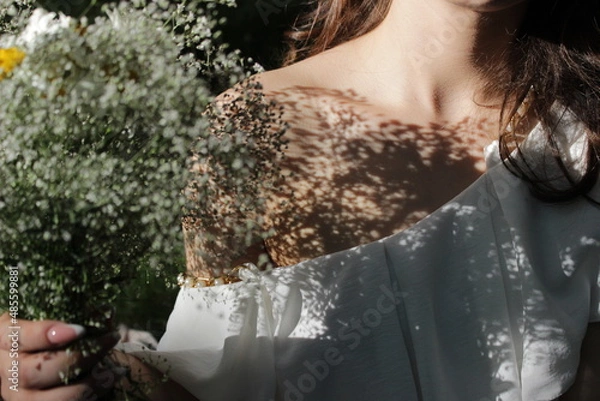 Fototapeta View on woman's neck, collarbone and shoulders, close-up