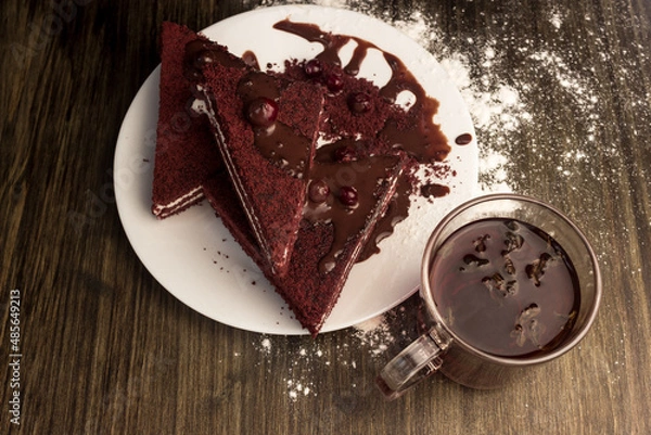 Fototapeta Cake with cranberries, hot chocolate and cream.