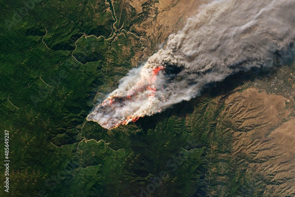 Fototapeta A flattering fire from space. Elements of this image were furnished by NASA