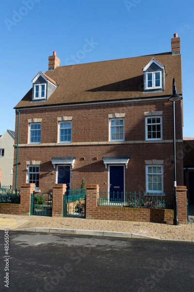 Fototapeta A pair of new semi-detached three storey homes with dormer windo