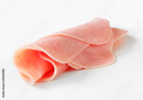 Fototapeta Rolled slices of ham