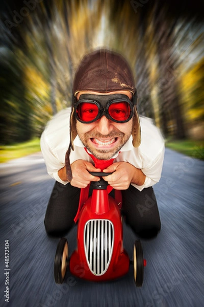 Obraz Driver on toy racing car