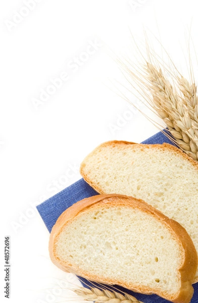 Fototapeta sliced bread and ears of wheat