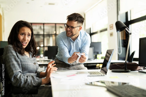 Fototapeta Colleagues arguing in office. Angry businessman yelling at his collegue.