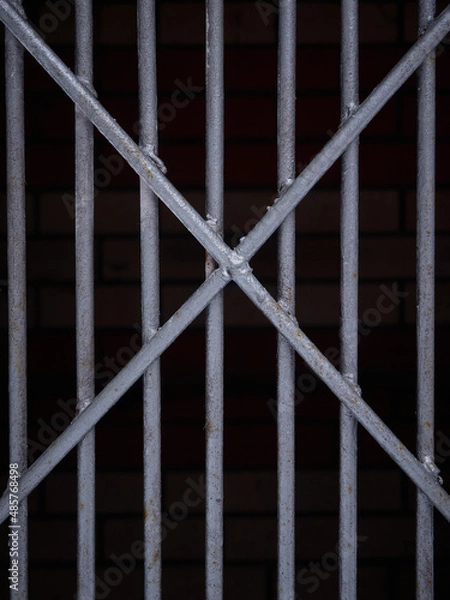 Fototapeta Texture of a gray metal grate with various elements