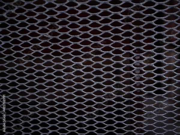 Fototapeta Texture of a gray metal grate with various elements