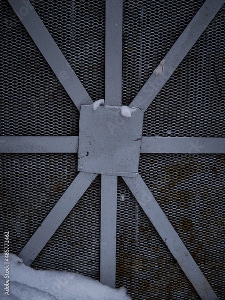 Fototapeta Texture of a gray metal grate with various elements
