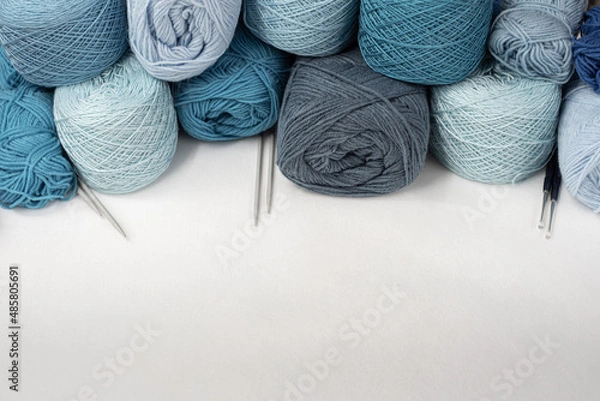 Fototapeta isolate yarn ball. Craft hobby with Vintage yarn ball on white ground, still life photo with soft focus. View from above. Handicraft day concept. Place for text. Crochet background blue Pastel.