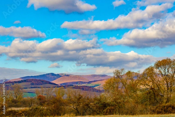 Fototapeta Autumn landscape with mountains and clouds