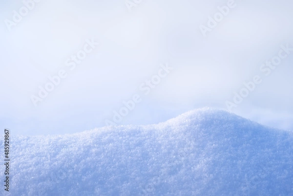 Fototapeta Natural podium from snow snowdrift for mockup display or presentation of products. Advertising theme concept. Blank winter and christmas background.