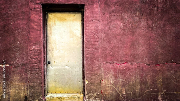 Fototapeta yellow faded door red stucco wall alley entrance grunge old deserted empty copy space architectural backdrop