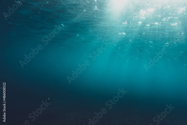 Obraz Clear blue water in ocean with sunbeams