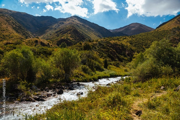 Fototapeta mountain gorge under sky with clouds