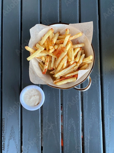 Obraz french fries in a bowl. cream sauce