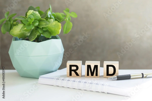 Fototapeta RMD required minimum distributions. text on wood cubes. text in black letters on wood blocks