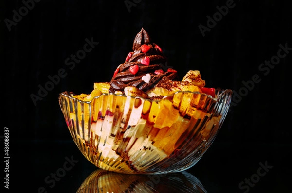 Obraz Fruit dessert with chocolate cream and sugar sprinkles