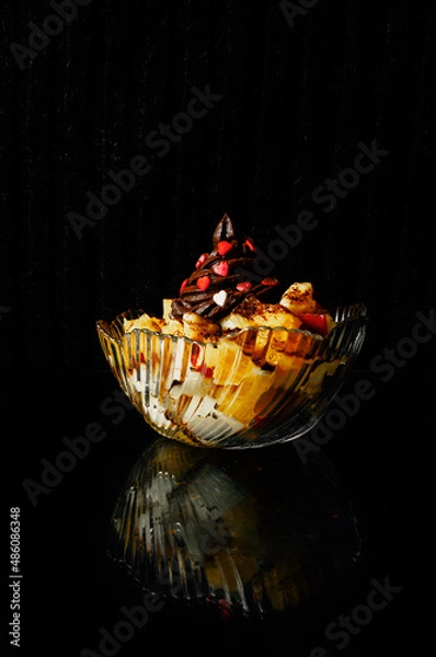 Obraz Fruit dessert with chocolate cream and sugar sprinkles