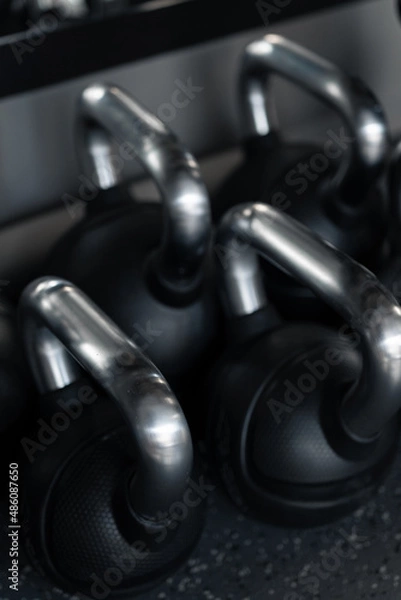 Fototapeta Dumbbells on the dumbbell rack in the gym.
