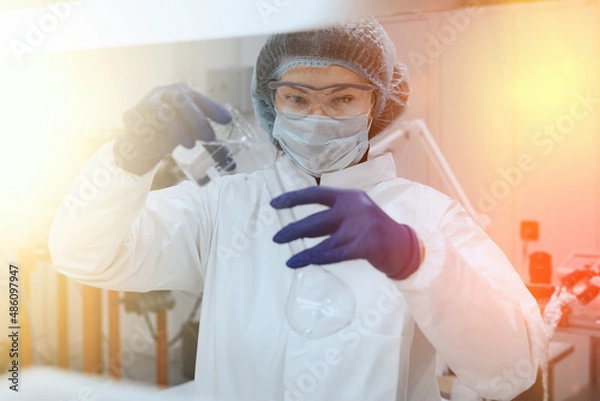 Obraz Scientist or nurse holding a test tube