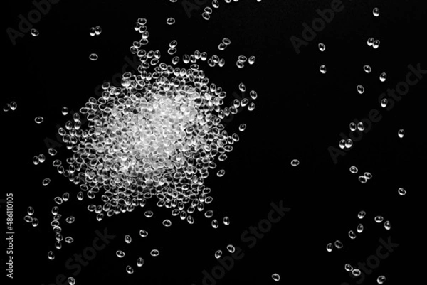Fototapeta white granules of polypropylene, polyamide in a test tube. Background. Plastic and polymer industry. Microplastic products.