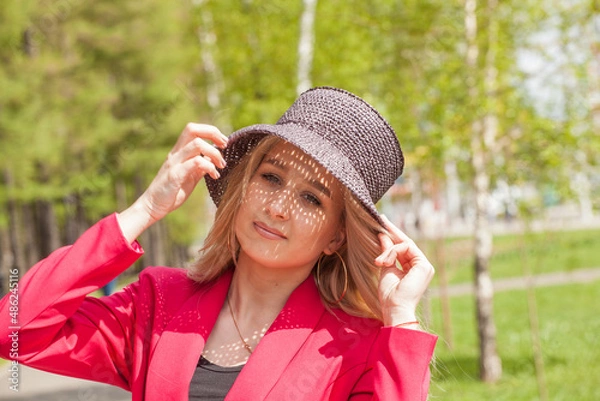 Obraz Beautiful blonde in a red jacket and hat. City Style
