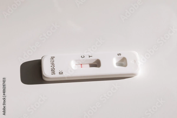 Fototapeta tablet and covid and disease test kit on a white background