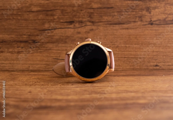 Obraz smartwatch on wooden background