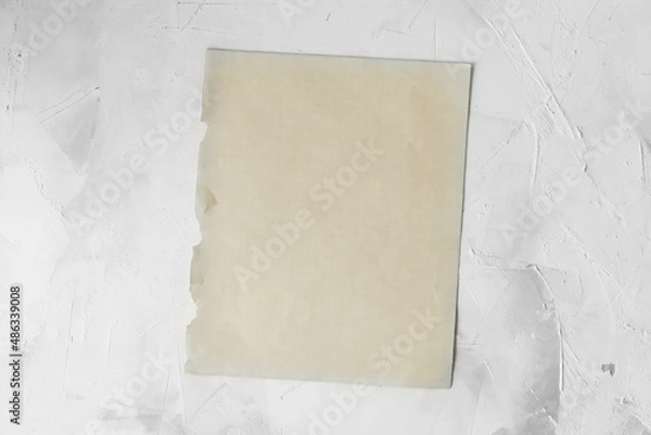 Fototapeta Empty space for the text. An old blank notebook sheet  on a light background.