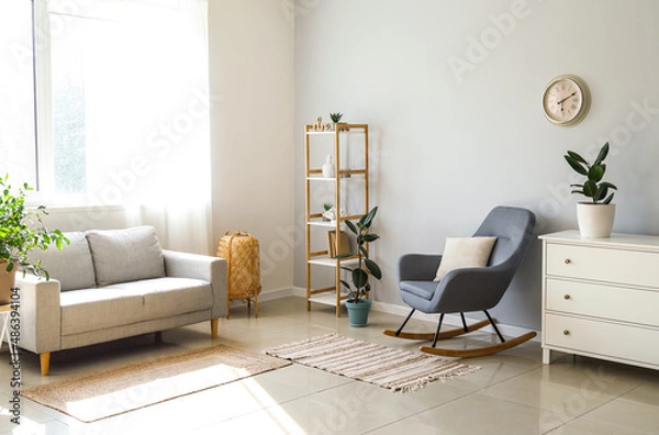 Fototapeta Interior of light living room with armchair, sofa and houseplants