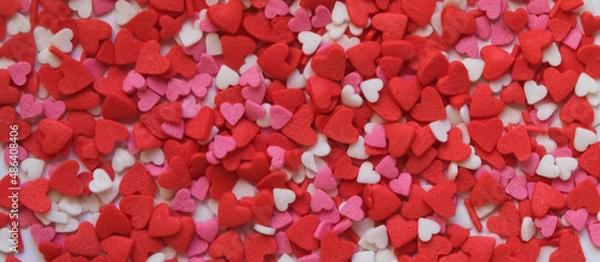 Fototapeta sprinkle hearts on a white background with a place for text