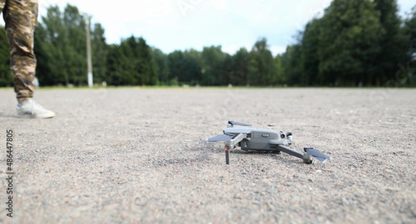 Fototapeta Small digital drone stands on ground closeup