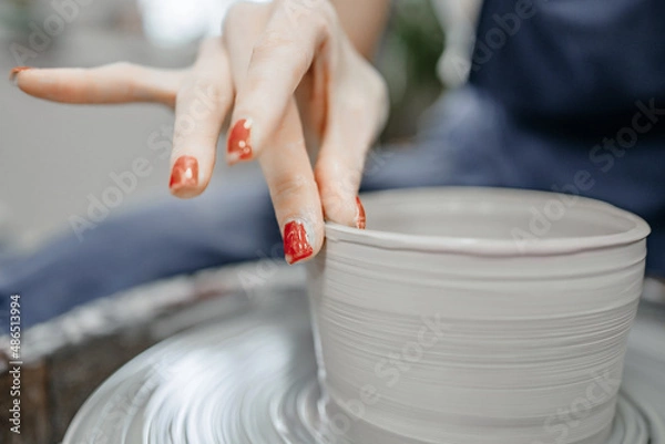Obraz Modeling clay on a potter's wheel